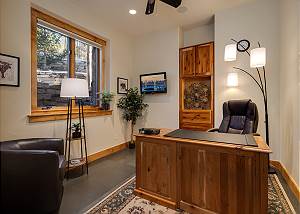 Private Office Space with desk, chair and armchair