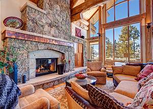 Admire the textured stone fireplace