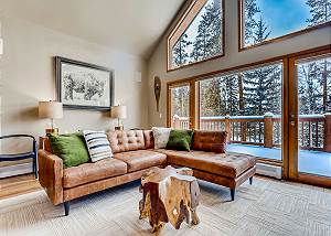 Living room with spacious deck access