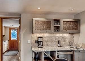 Bar adjacent to kitchen and dining
