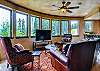 Quaint den opens to dining area