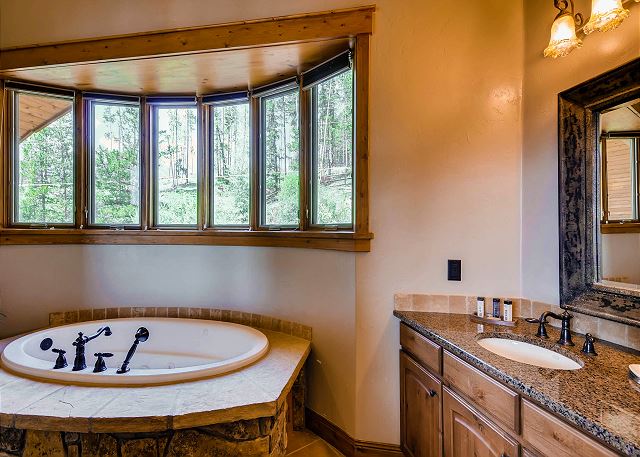 with 2 vanities, large jetted tub and separate walk-in shower with dual shower heads