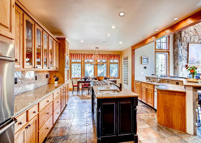 Kitchen with all high end appliances, two sinks, two dishwashers, breakfast bar and open to the Great Room