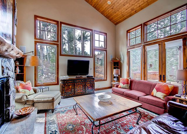 Great Room with lots of natural light, flat screen TV and gas fireplace - sits adjacent to Kitchen
