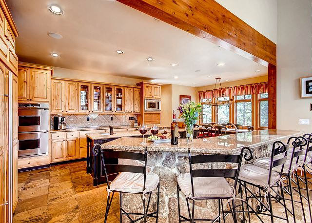 Expansive Kitchen with lots of workspace, high end appliances and kitchen breakfast bar