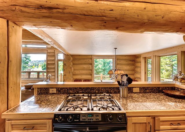 Gas stove looking over to dining and living area