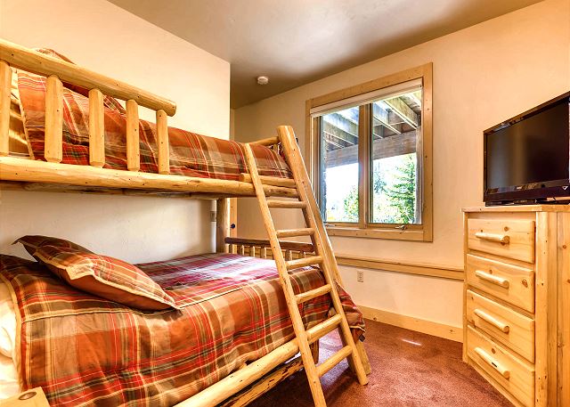 Spruce Bunk - sleeps 3-4 in a captain's bunk trundle (twin on top, twin trundle on pull out bottom, double (full) on lower bunk)