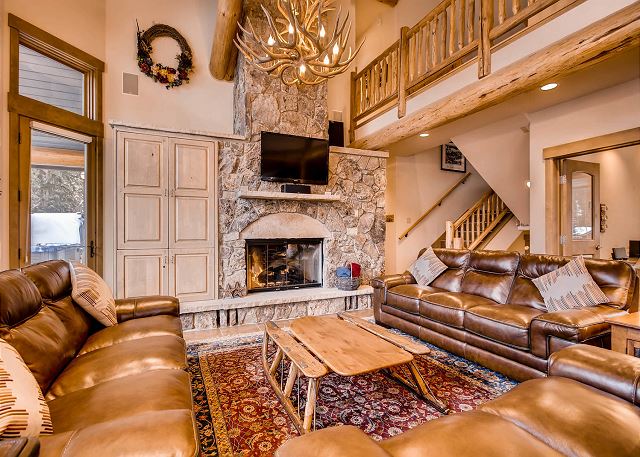 by fireside in this spacious and comfy living room