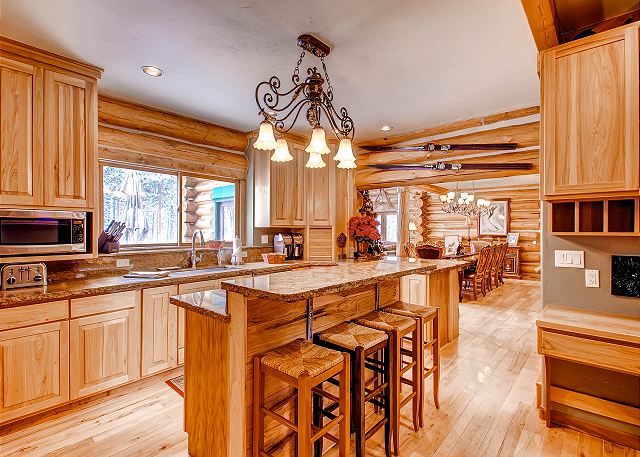 main level kitchen with counter space and bar seating for 4