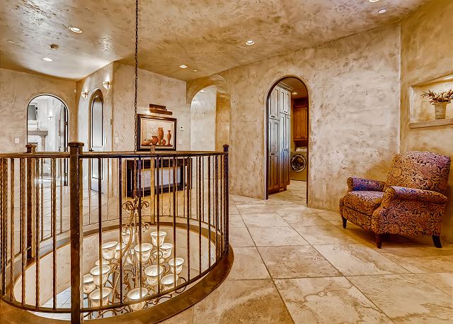 leads to all 5 Bedroom Suites, Secret Library, Laundry Room and stairway up to the Rooftop Level