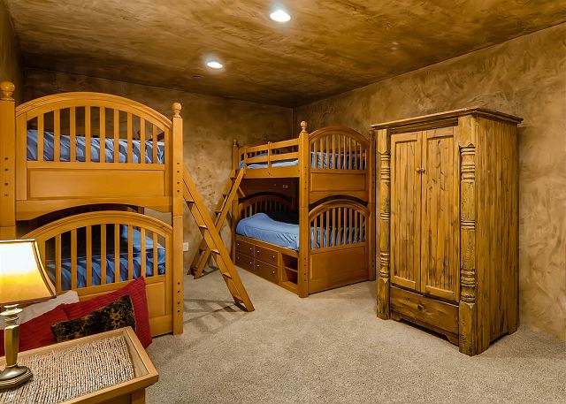 - Sleeps 4 in two sets of bunks, uses powder bath in hall