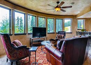 Quaint den opens to dining area