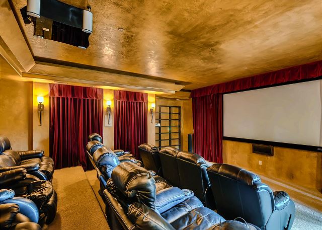 with comfy recliners and projection screen