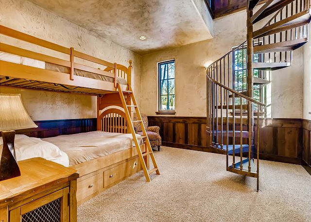 off of the Breakfast Nook, spiral staircase leads up to the library
