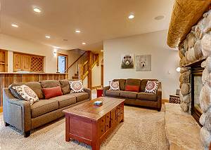 Fireplace, comfy couches and brightly lit