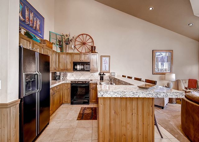 Fully stocked kitchen with ice maker in fridge