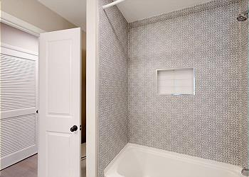 Guest Bathroom with Tiled Tub and Shower Combination