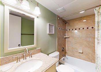 Guest Bathroom with Tiled Tub and Shower Combination