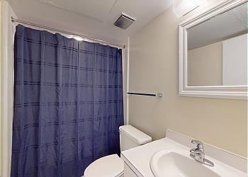 En-Suite Guest Bathroom with Tub and Shower Combination