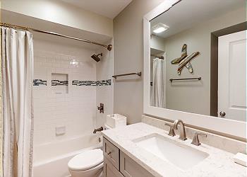Guest Bathroom with Custom Tiled Tub and Shower Combination