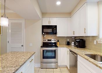 Kitchen with Custom Cabinetry and Stainless Steel Appliances