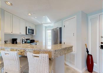 Kitchen with Granite and Bar Seating for Three