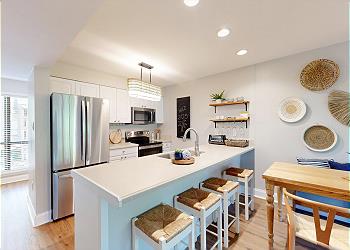 Fully Stocked Kitchen with Countertop Seating