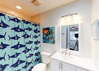 En-suite Guest Bathroom with Tub and Shower Combination