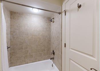 En-Suite Bathroom with Tub and Shower Combination