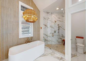 Recently Renovated Master Bathroom with Tiled Walk-in Shower and