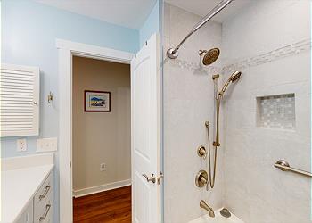 Newly Updated Guest Bathroom with Tiled Tub and Shower Combinati