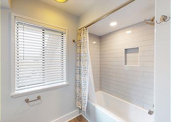 Newly Updated Bathroom with Tub and Shower Combination