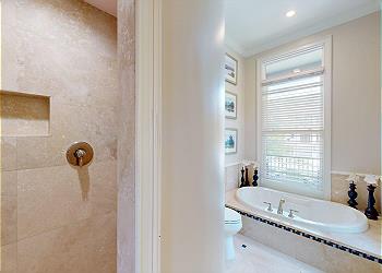 En-suite Guest Bathroom with Tiled Walk-in Shower and Tub