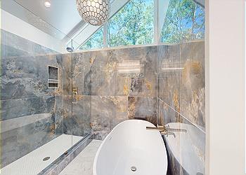 Newly Renovated Primary Bathroom with Freestanding Tub and Tiled