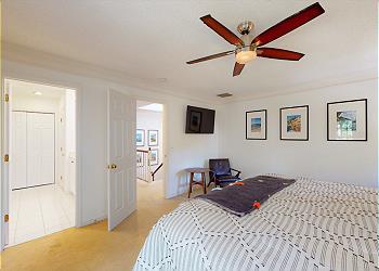 Primary Bedroom with Wall-Mounted Smart TV