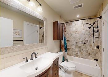 Guest Bathroom with Tiled Tub and Shower Combination