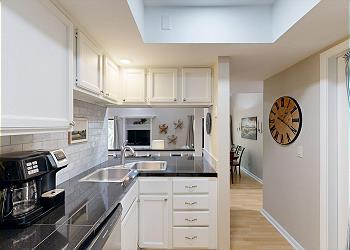Fully Stocked Kitchen with Countertop Seating