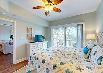Primary Bedroom with View of the Ocean and Community Pool