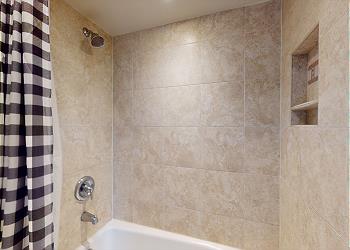 En-Suite Bathroom with Tub and Shower Combination