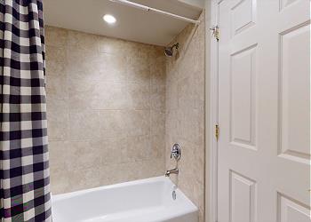 En-Suite Bathroom with Tub and Shower Combination