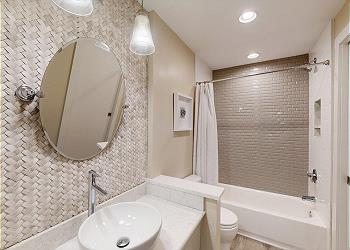 Guest Bathroom with Tiled Tub and Shower Combination