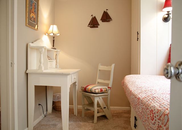 Bedroom 3 features a twin day bed and a small desk
