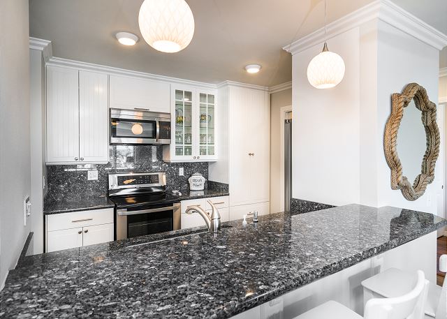 Kitchen featuring granite counter-tops and brand new stainless-s