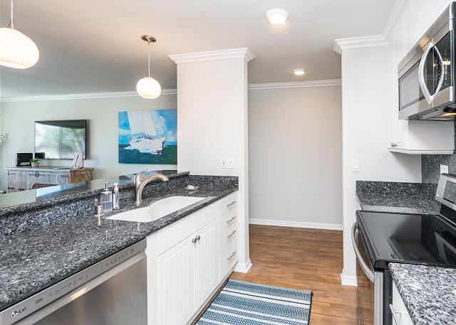Kitchen featuring granite counter-tops and brand new stainless-s