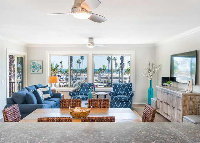 The interior living space displays views of the Pacific Ocean