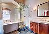 Main level master private bath with walk-in steam shower, bathtub and 1 sink - 10 Southface -Breckenridge Vacation Rental