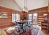 View from kitchen into dining area and deck access - 10 Southface - Breckenridge Vacation Rental