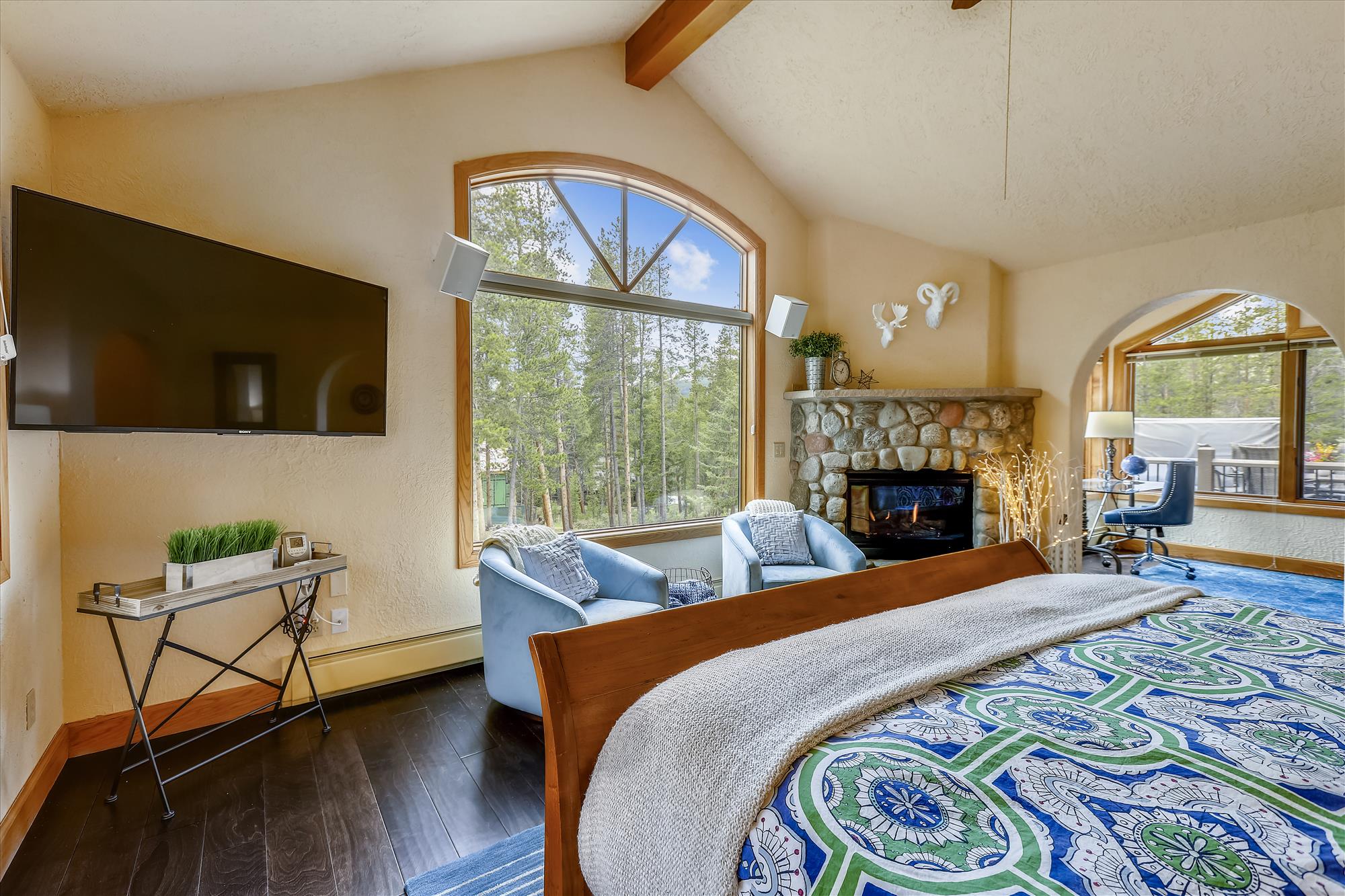 Enjoy a relaxing evening in this spacious master bedroom - Evergreen Lodge Breckenridge Vacation Rental