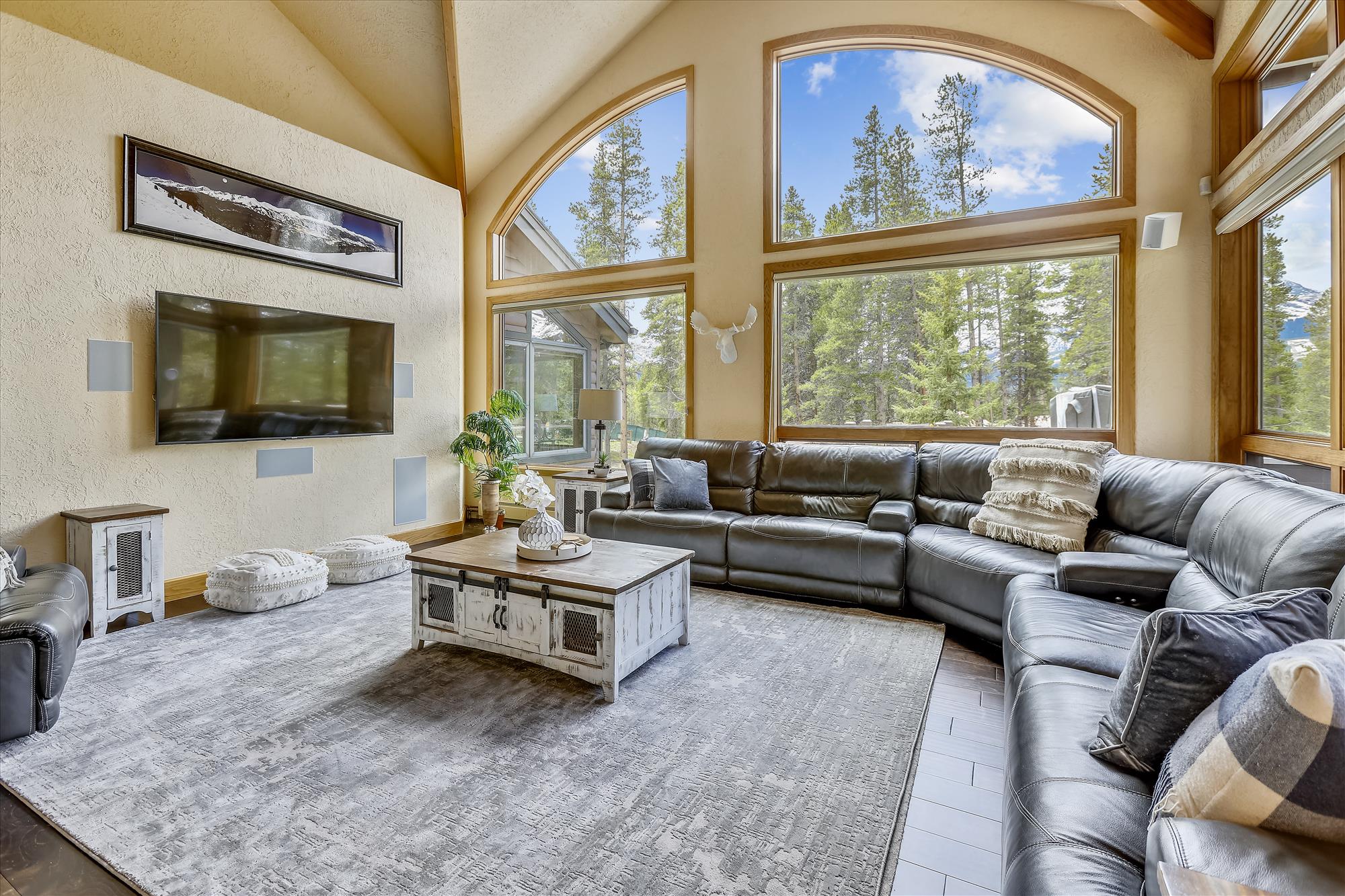 Have a relaxing movie night with family and friends in this spacious living room - Evergreen Lodge Breckenridge Vacation Rental