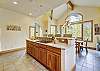 Kitchen island with stovetop and bar seating - Evergreen Lodge Breckenridge Vacation Rental 